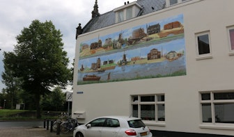Bedrijvigheid Vaartsche Rijn afgebeeld op grote muurschildering Westravenstraat